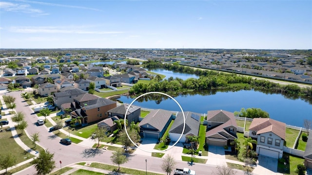 bird's eye view with a water view and a residential view