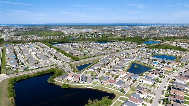 birds eye view of property with a residential view and a water view