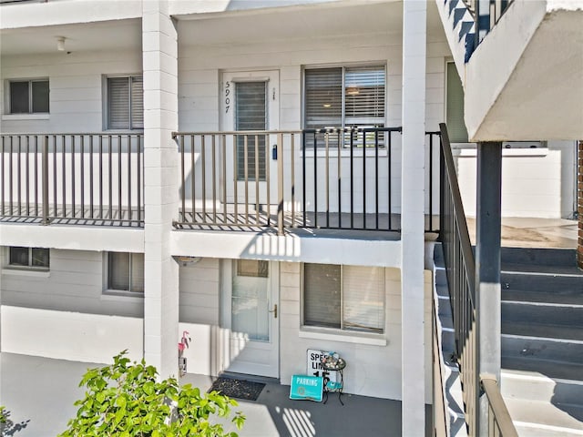 exterior space featuring a balcony and covered porch
