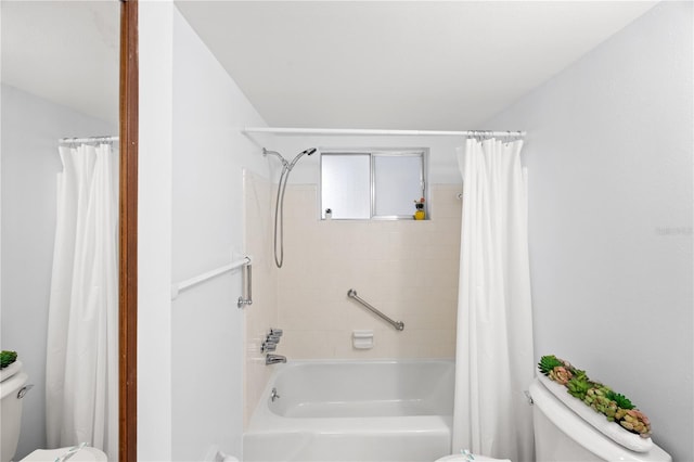 full bathroom with shower / tub combo and toilet
