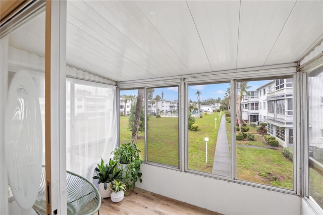 unfurnished sunroom featuring a residential view