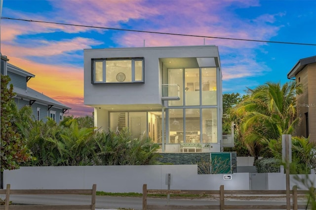 modern home with a fenced front yard