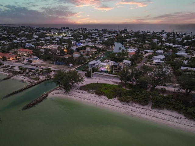 aerial view featuring a view of the beach and a water view