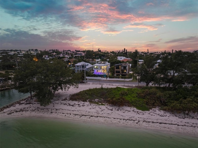 bird's eye view with a water view and a view of the beach