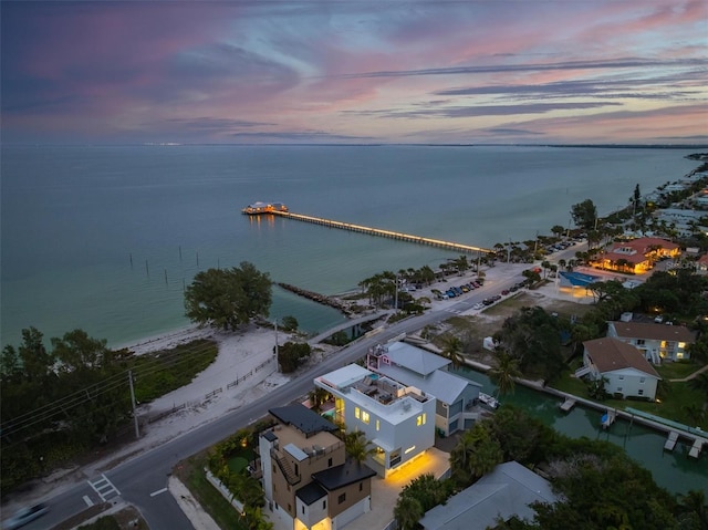 aerial view at dusk with a water view