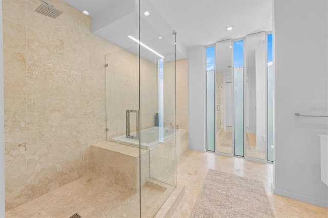 bathroom with a garden tub, visible vents, and walk in shower