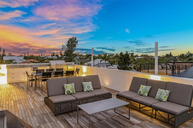 deck featuring outdoor dining space and an outdoor living space