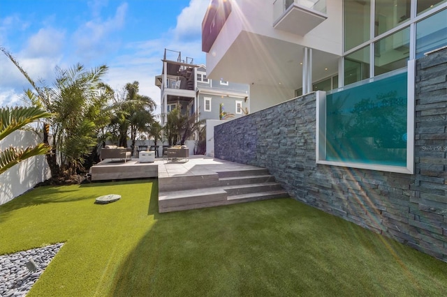 view of yard with a patio and fence