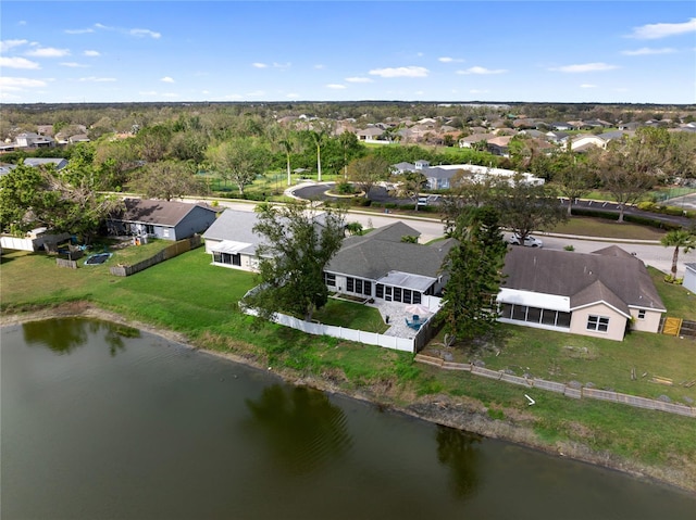 birds eye view of property with a residential view and a water view