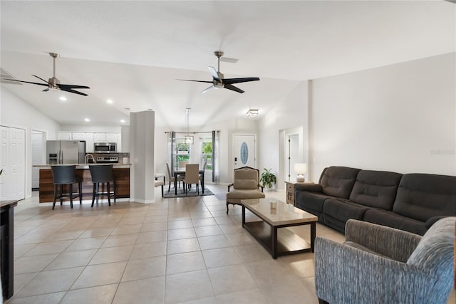 living area featuring high vaulted ceiling, light tile patterned flooring, a ceiling fan, and recessed lighting