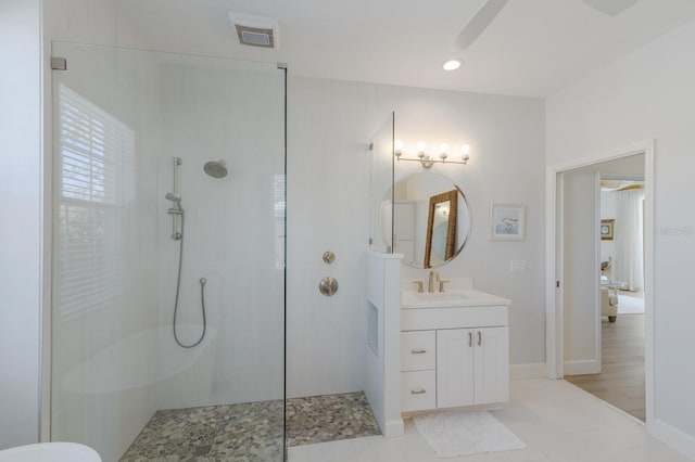 bathroom with a walk in shower, recessed lighting, visible vents, vanity, and baseboards