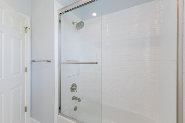 full bath featuring enclosed tub / shower combo