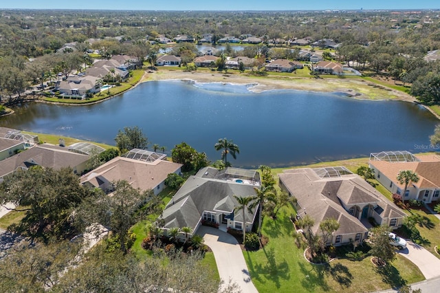 bird's eye view featuring a water view and a residential view