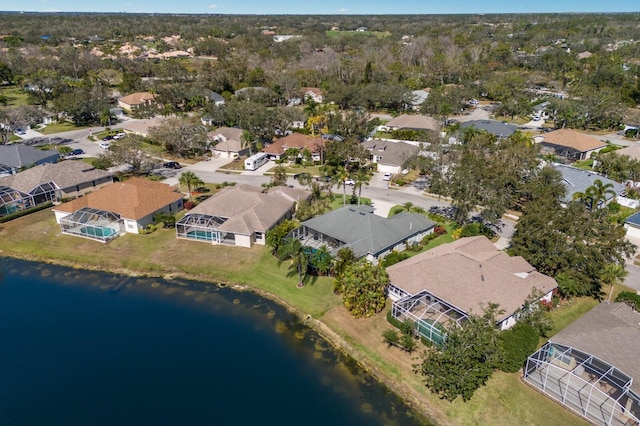 birds eye view of property featuring a residential view and a water view