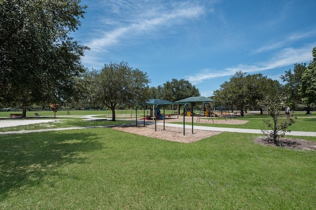 community play area with a lawn