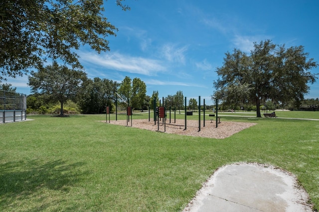 exterior space with playground community and a lawn