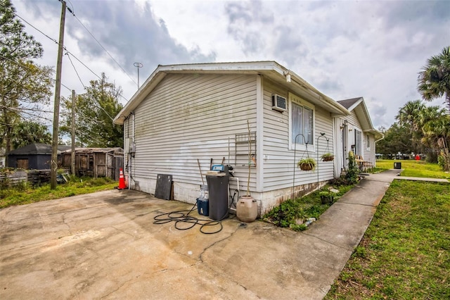 view of side of home with a patio