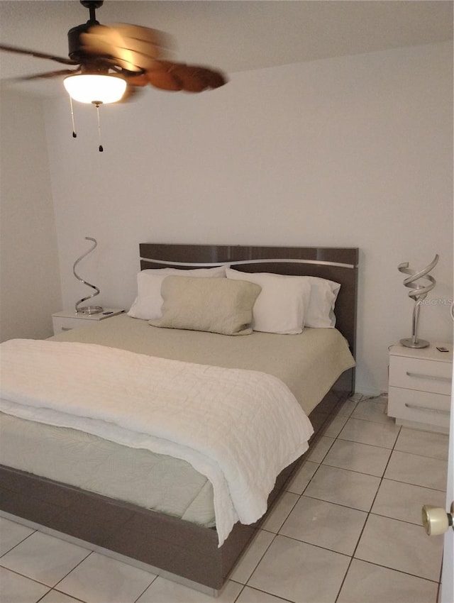 bedroom with light tile patterned floors and a ceiling fan