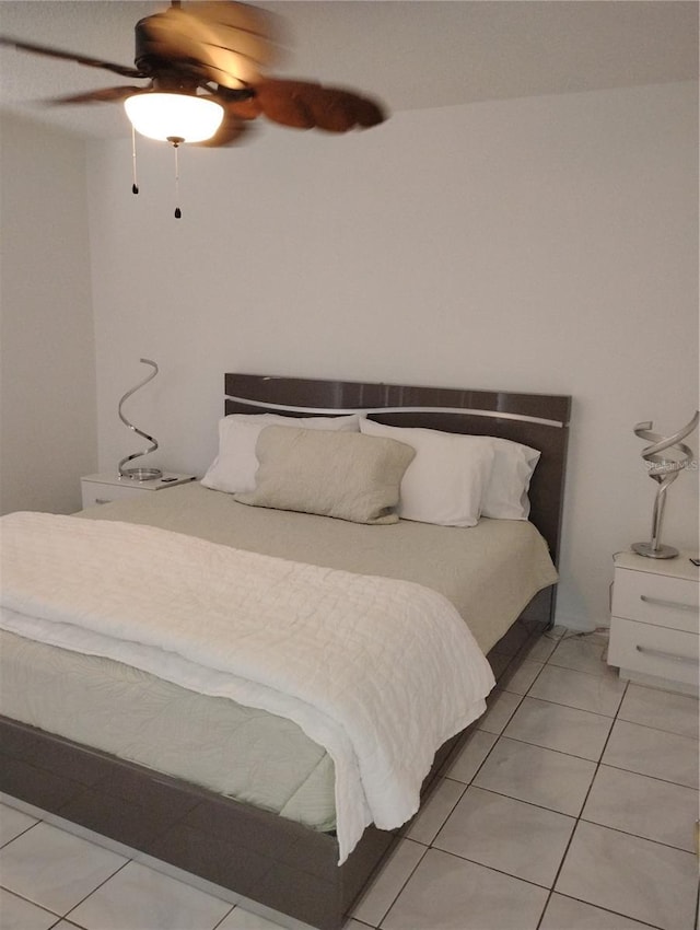 bedroom featuring light tile patterned floors and ceiling fan