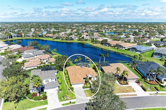 bird's eye view featuring a water view and a residential view