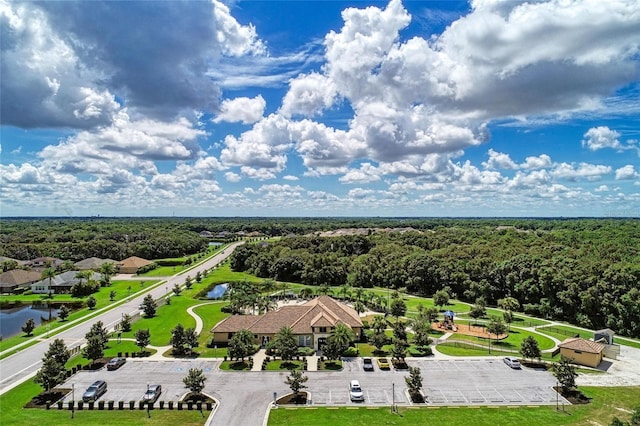 birds eye view of property with a wooded view