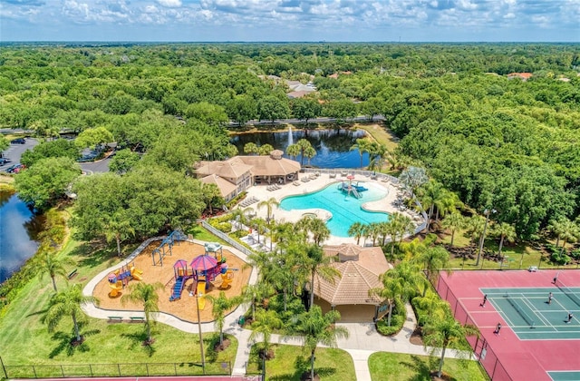 aerial view featuring a water view and a wooded view