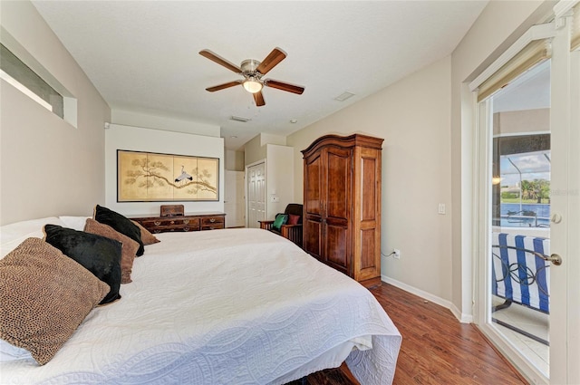 bedroom featuring visible vents, baseboards, ceiling fan, wood finished floors, and access to outside