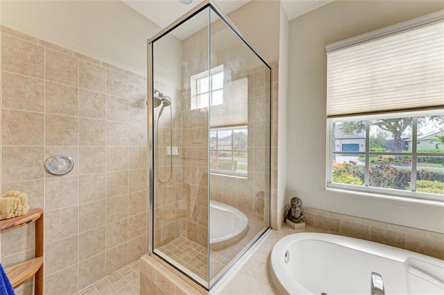 bathroom with a shower stall and a bath