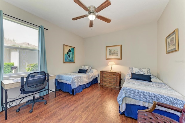 bedroom with ceiling fan and wood finished floors