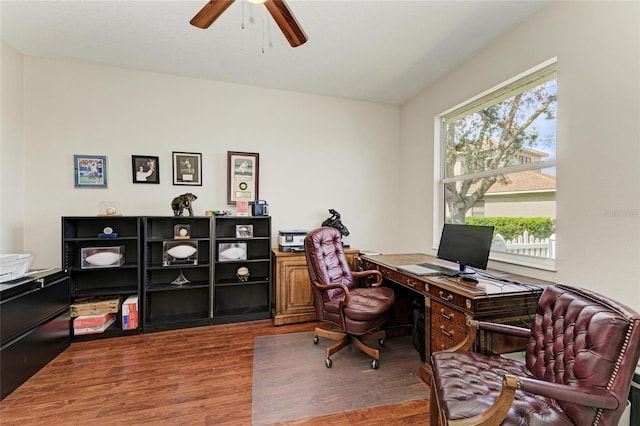 office space with a ceiling fan and wood finished floors