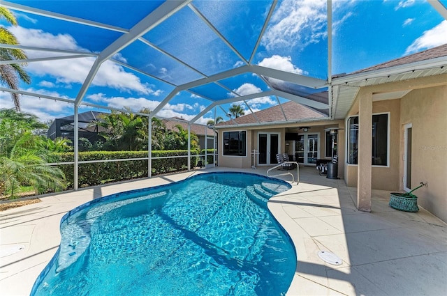 pool featuring a lanai and a patio