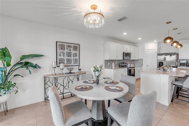 dining area featuring light tile patterned floors, baseboards, visible vents, a chandelier, and recessed lighting