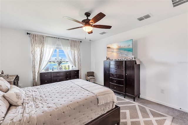 bedroom with carpet, visible vents, and baseboards