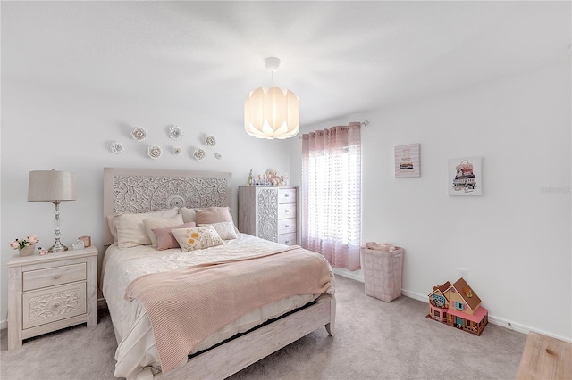 bedroom with carpet floors and baseboards