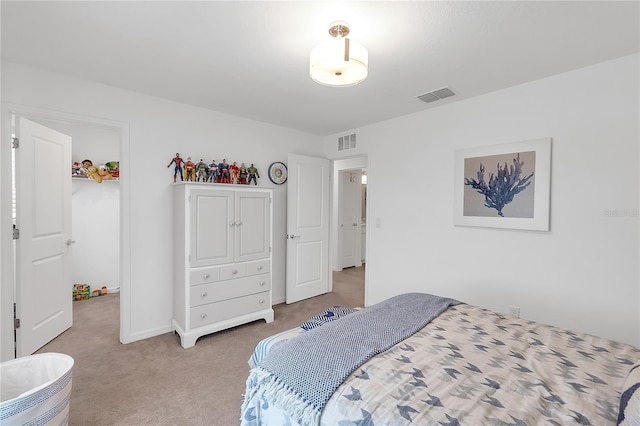 bedroom with baseboards, visible vents, and carpet flooring