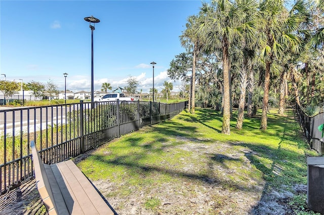 view of yard with fence and a residential view