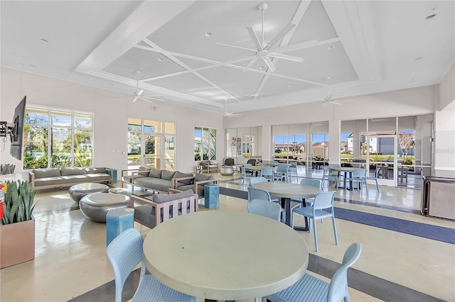 sunroom / solarium with coffered ceiling and a ceiling fan