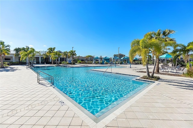 community pool with a patio area