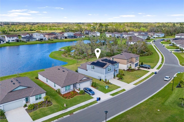 aerial view featuring a water view and a residential view