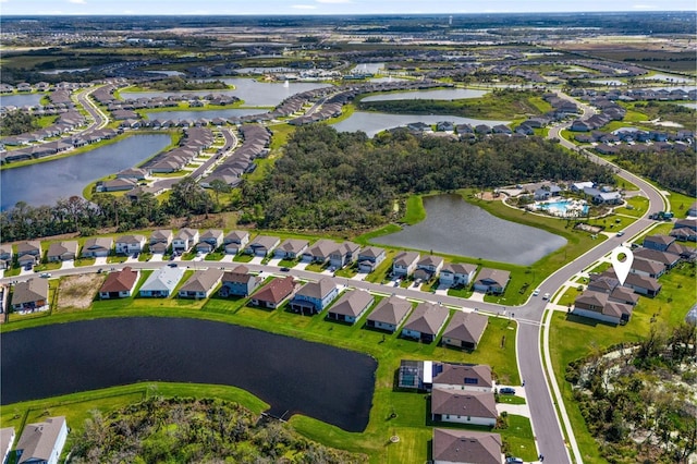 aerial view featuring a water view and a residential view