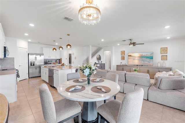 dining space featuring light tile patterned floors, visible vents, and recessed lighting