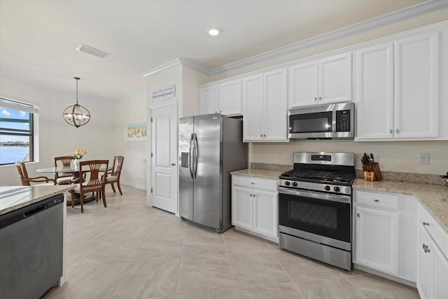 kitchen featuring visible vents, stainless steel appliances, hanging light fixtures, and white cabinetry