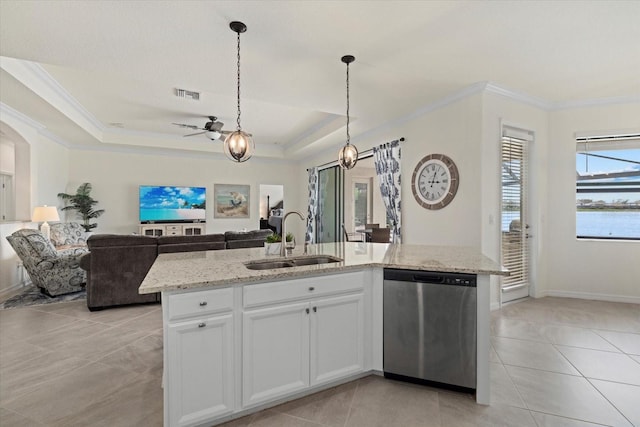 kitchen featuring white cabinets, dishwasher, an island with sink, open floor plan, and a sink