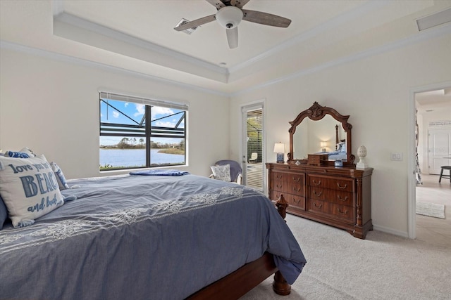 bedroom with ornamental molding, a raised ceiling, light carpet, and baseboards