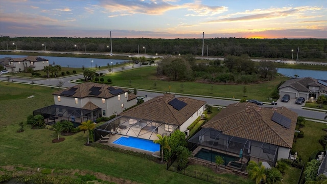 bird's eye view featuring a residential view and a water view