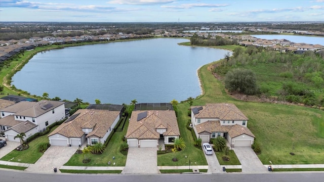 bird's eye view featuring a water view and a residential view