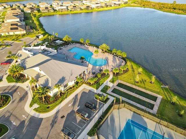 bird's eye view featuring a residential view and a water view