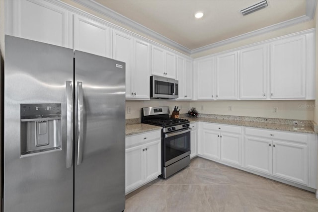 kitchen with light stone counters, recessed lighting, visible vents, appliances with stainless steel finishes, and white cabinets