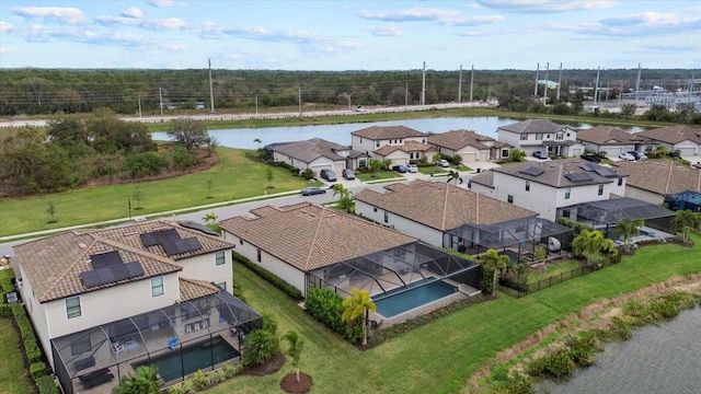 bird's eye view featuring a water view and a residential view