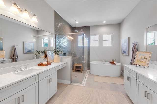 bathroom with a soaking tub, tile patterned flooring, vanity, a shower stall, and recessed lighting